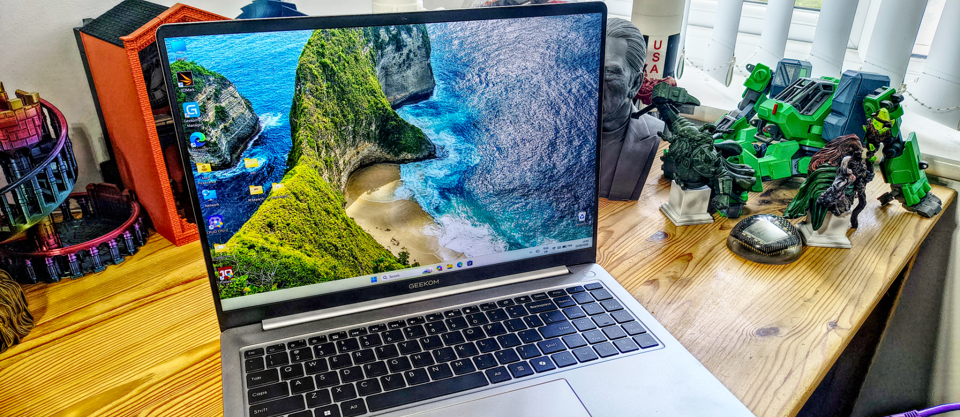 Geekom GeekBook M16 on a desk in a home office during our review