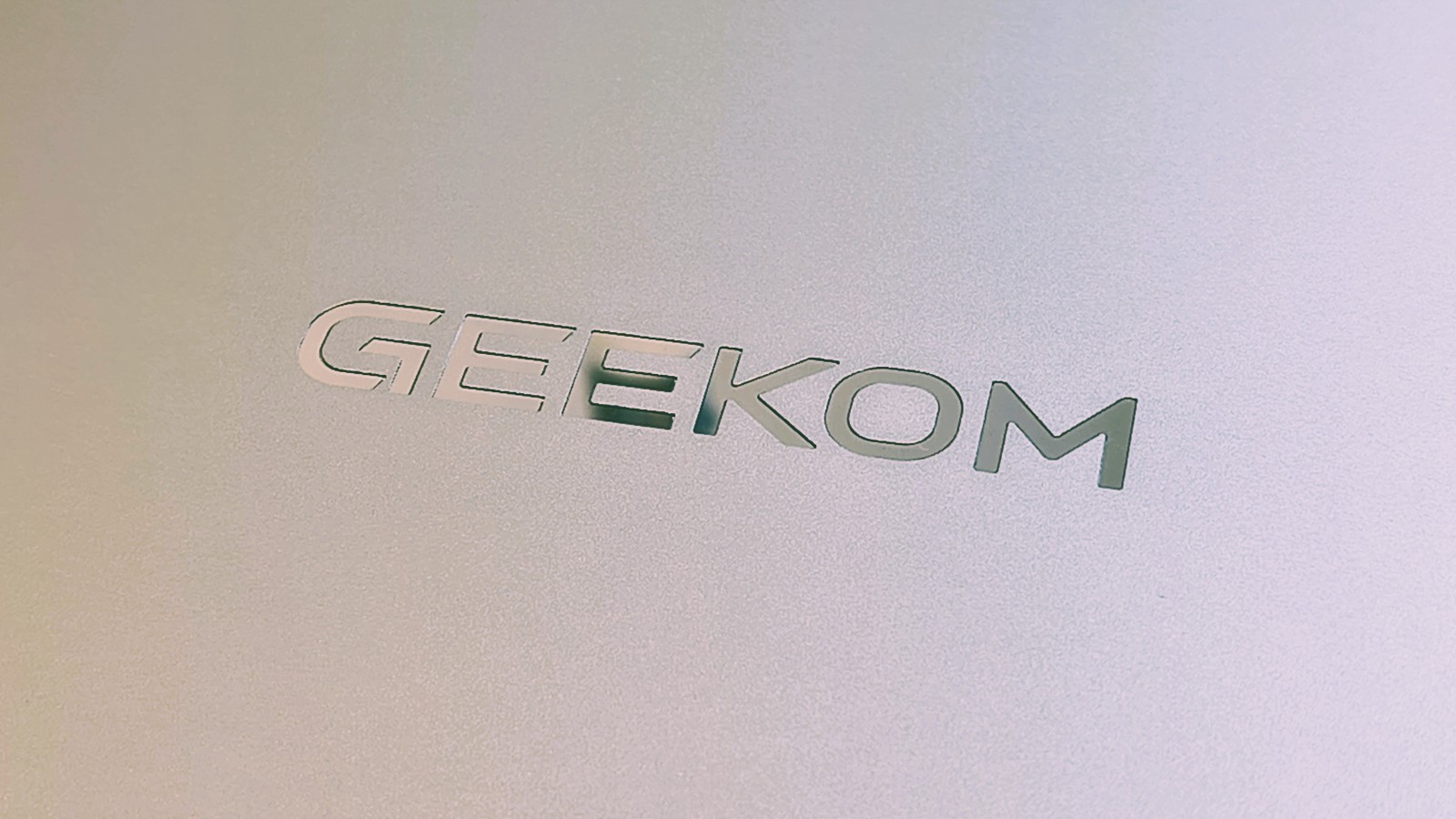 Geekom GeekBook M16 on a desk in a home office during our review