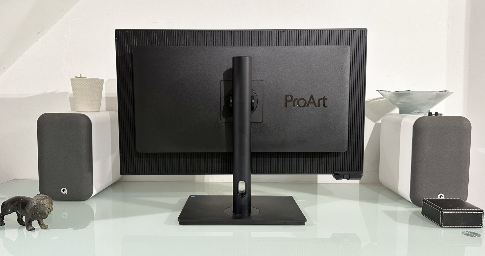 The Asus ProArt PA32KCX 8K monitor on a white desk in a home office during our review process