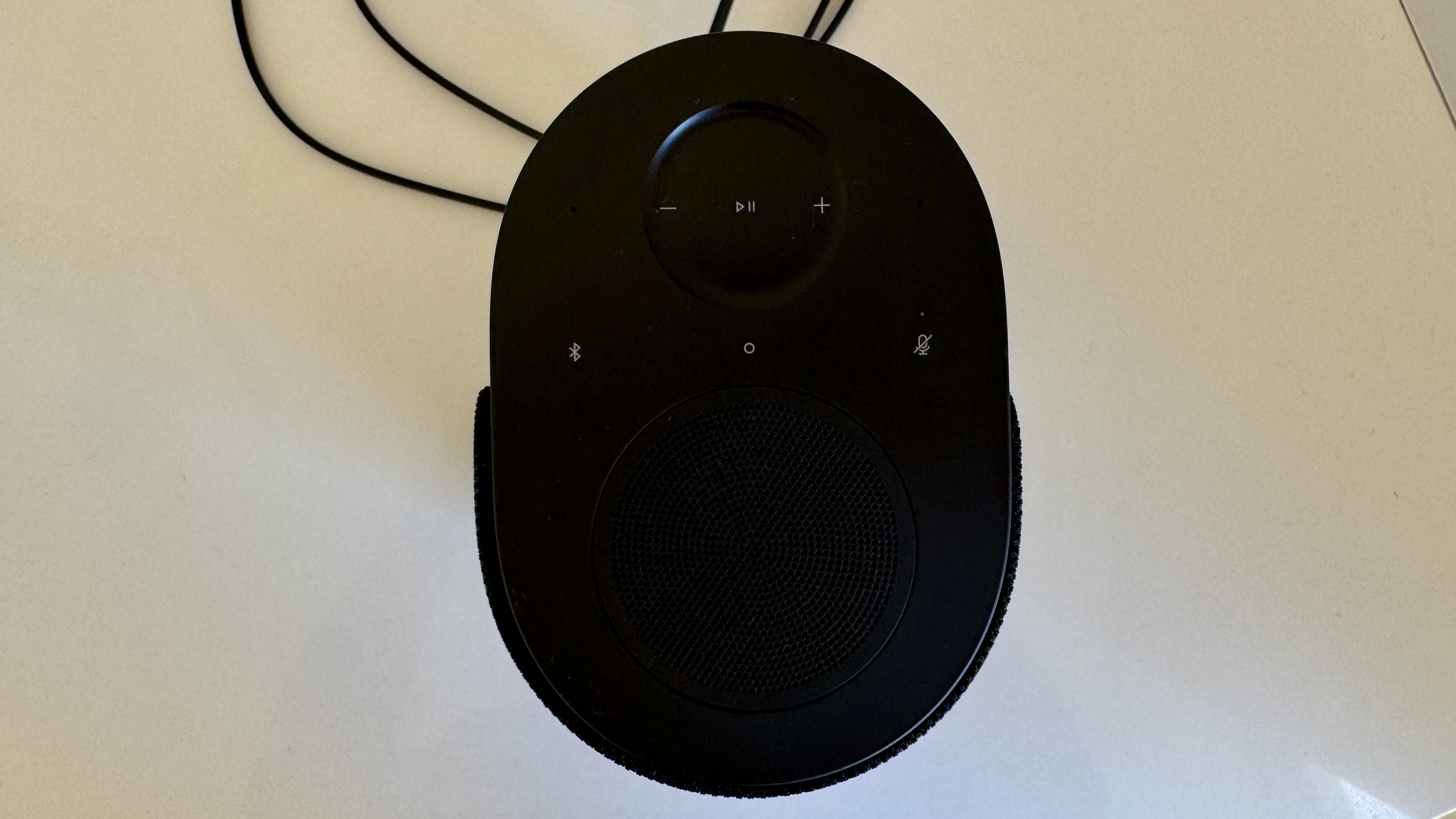 Bose Lifestyle Ultra speaker on a white table