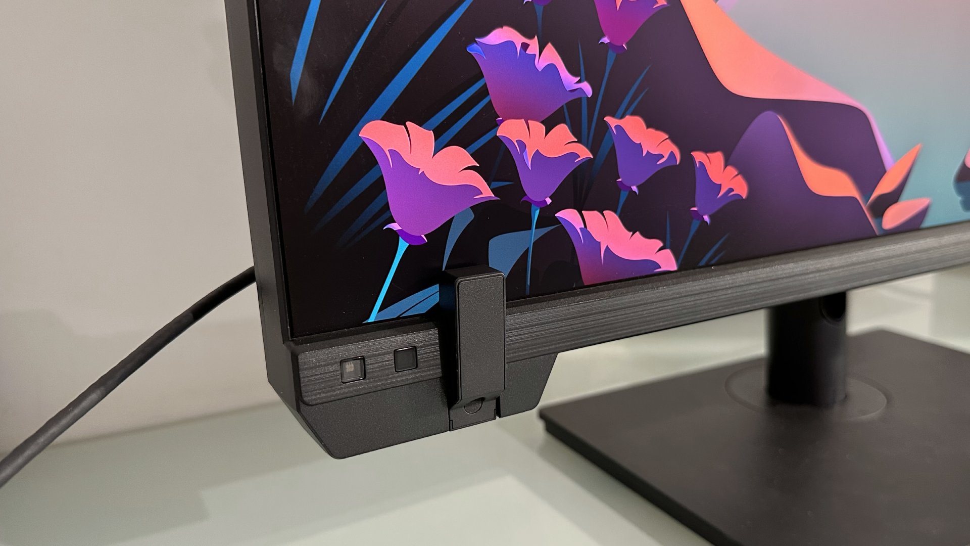 The Asus ProArt PA32KCX 8K monitor on a white desk in a home office during our review process